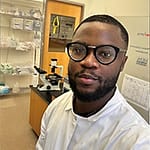 Man with Glasses in a Lab Wearing a White Shirt