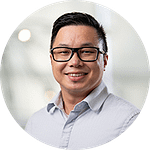 Man with Glasses in Blue Shirt