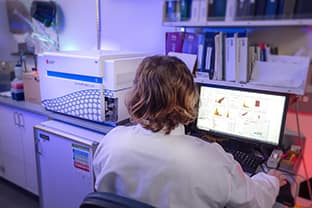 woman looking at computer screen